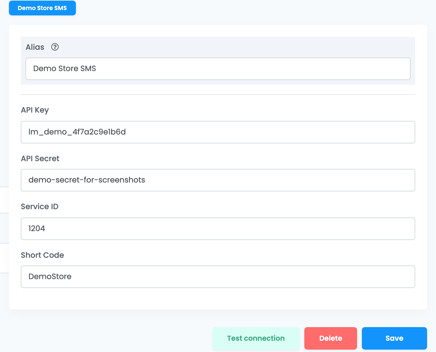 Das Link-Mobility-Formular: Alias „Demo Store SMS“, API Key, API Secret, Service ID und Short Code „DemoStore“, mit den Schaltflächen Test connection, Delete und Save.